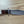 Cargar imagen en el visor de la galería, Cuchillo forjado  “Cowboy Bowie” de Nil Fonsere, con cuero, colmillo de facochero y gemelo a conjunto
