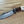 Cargar imagen en el visor de la galería, Cuchillo forjado  “Cowboy Bowie” de Nil Fonsere, con cuero, colmillo de facochero y gemelo a conjunto
